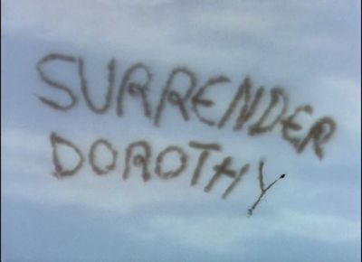 Surrender Dorothy written in the sky